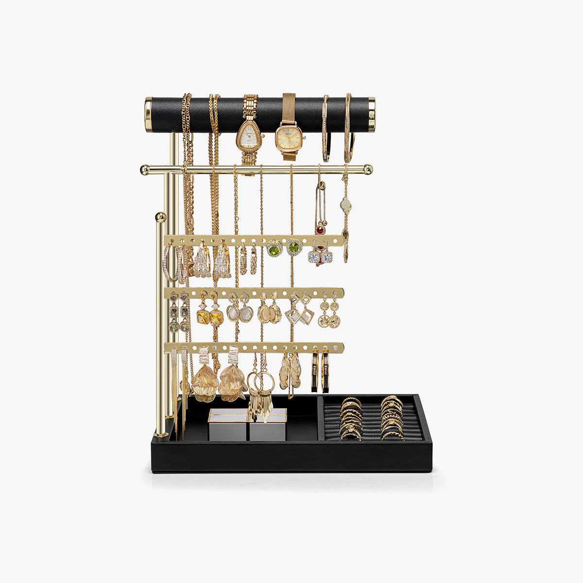 A compact jewelry station keeps four everyday pieces visible on a dresser.