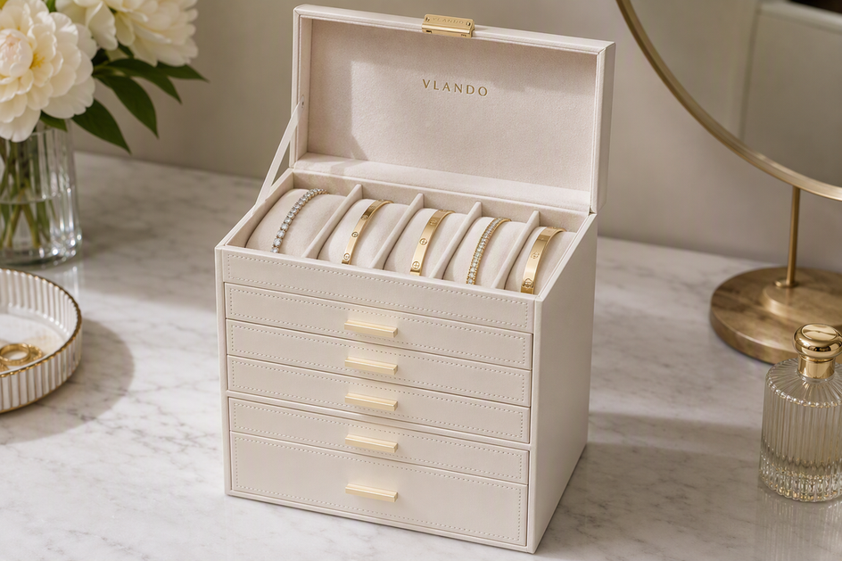 Jewelry organizer holding tennis bracelets and bangles in separate cushioned sections