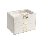 Cream white four-layer jewelry box with glass lid, three drawers and refined gold-tone hardware