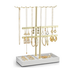 Cloud white two-tier leather jewelry stand with rotating gold bars for necklaces, bracelets, earrings and rings